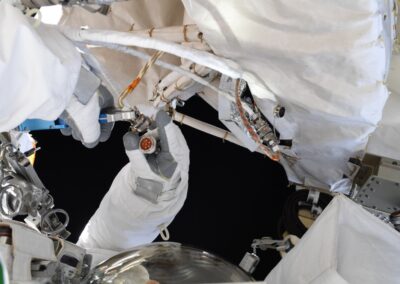 Astronaut hand, installing the EVA Power Cable on UTTPS