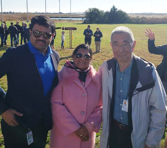 Selva J, Prathiba R and Nobel Laureate, Samuel Ting standing in field at launch.